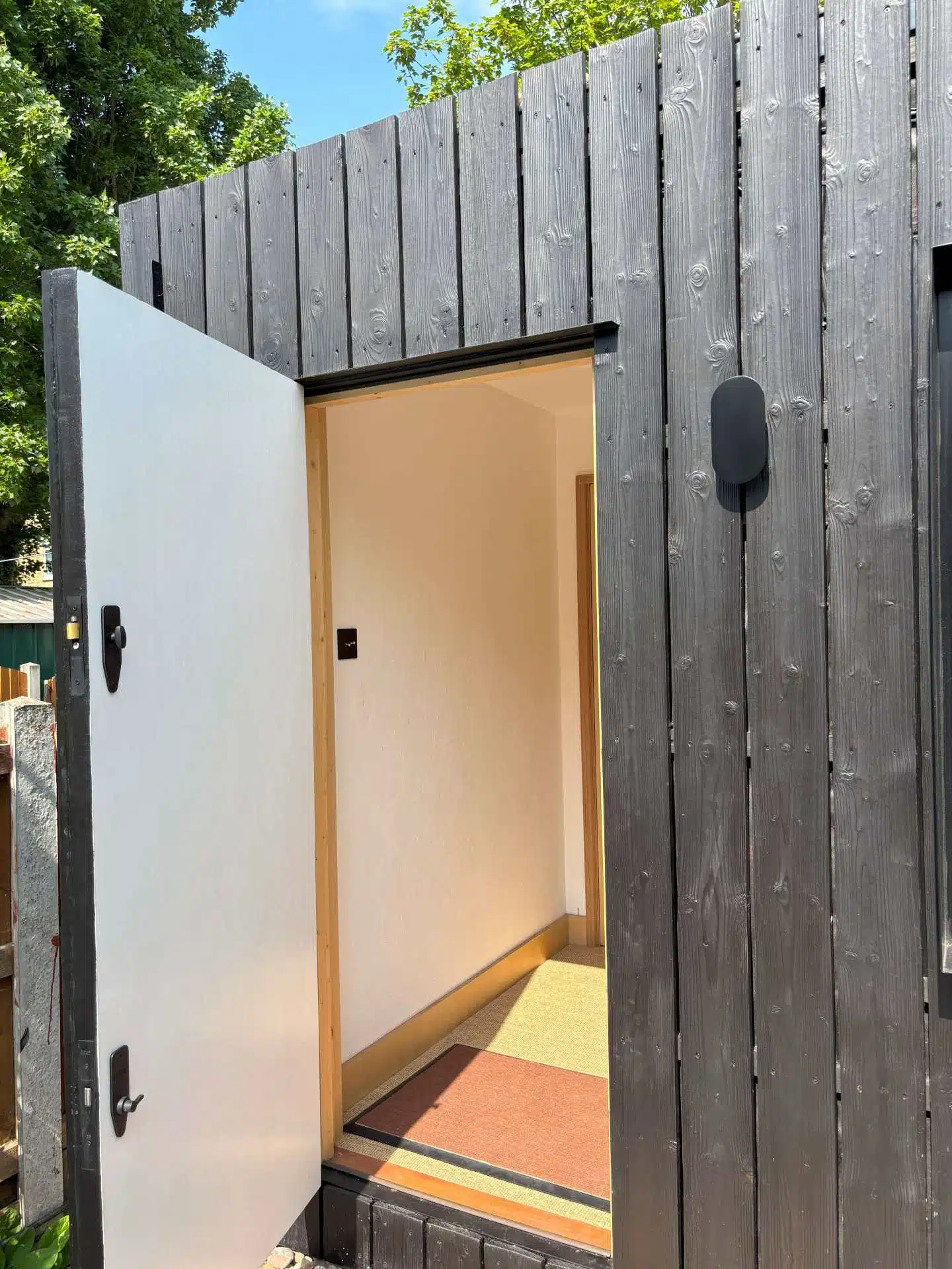 Studio door and front in charred wide spruce